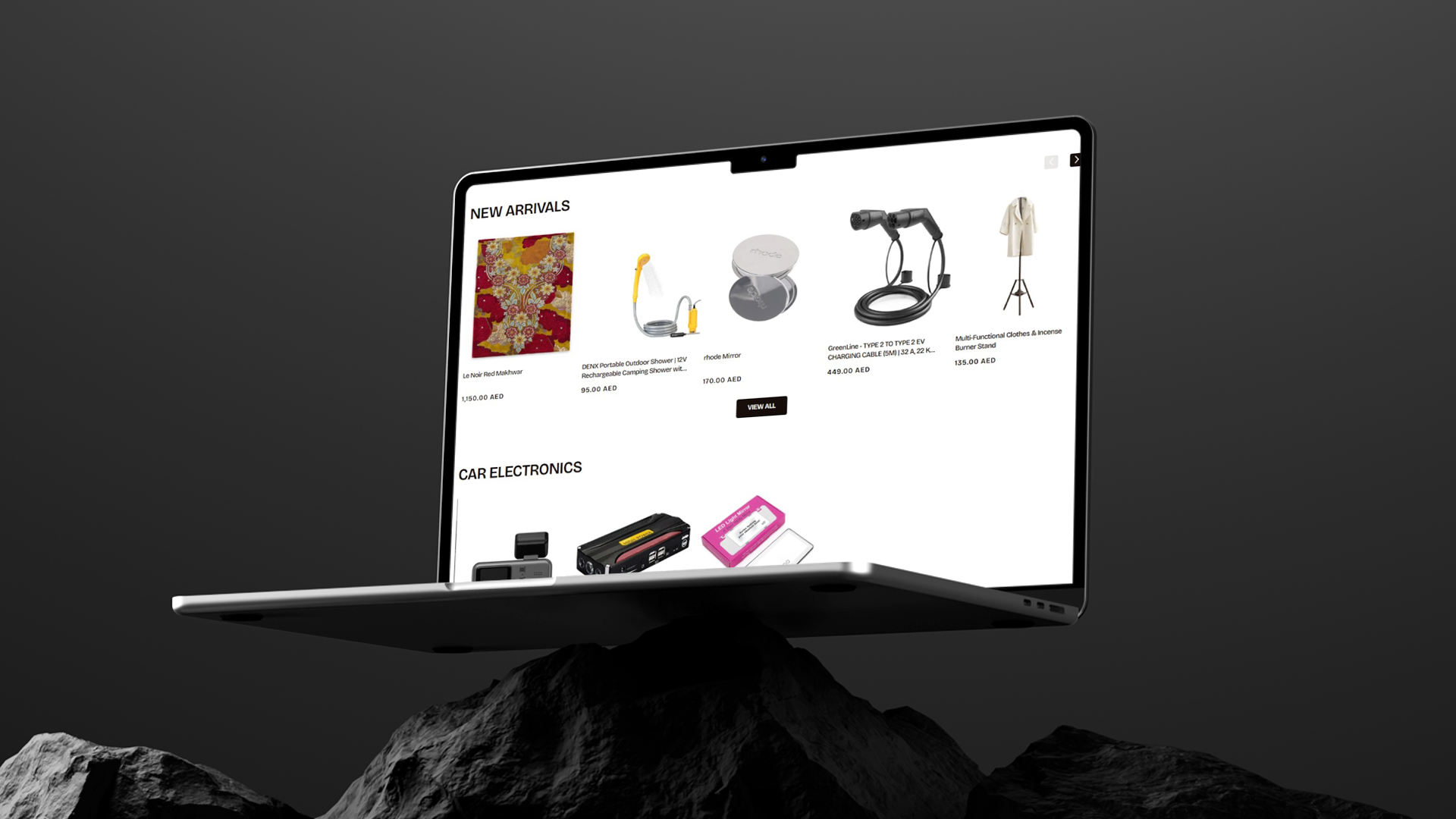Laptop displaying NARA Space e-commerce website on a dark background