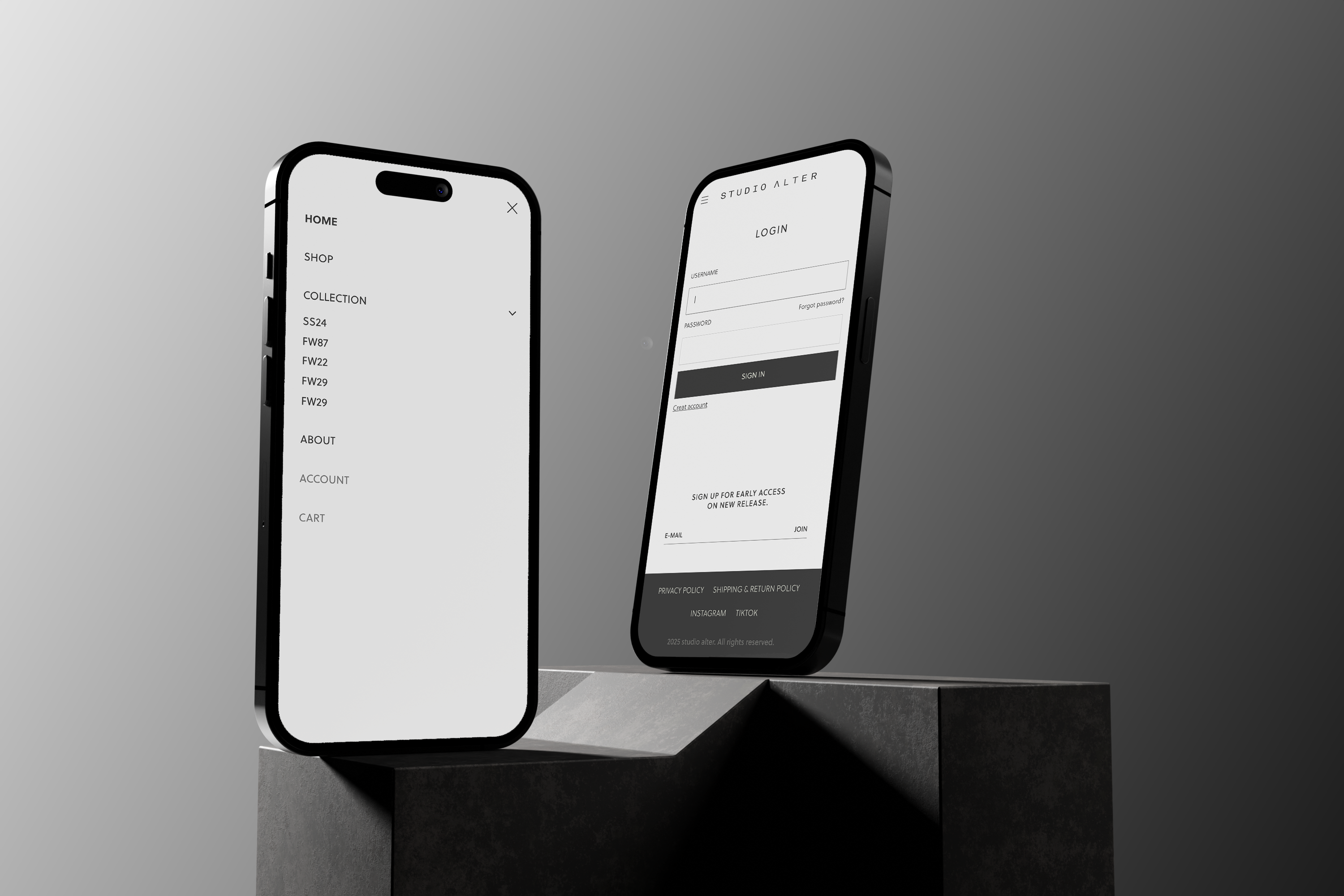 Two black smartphones displayed upright on a dark pedestal against a gray studio background, each showing a clean Studio Alter website interface on the screen.